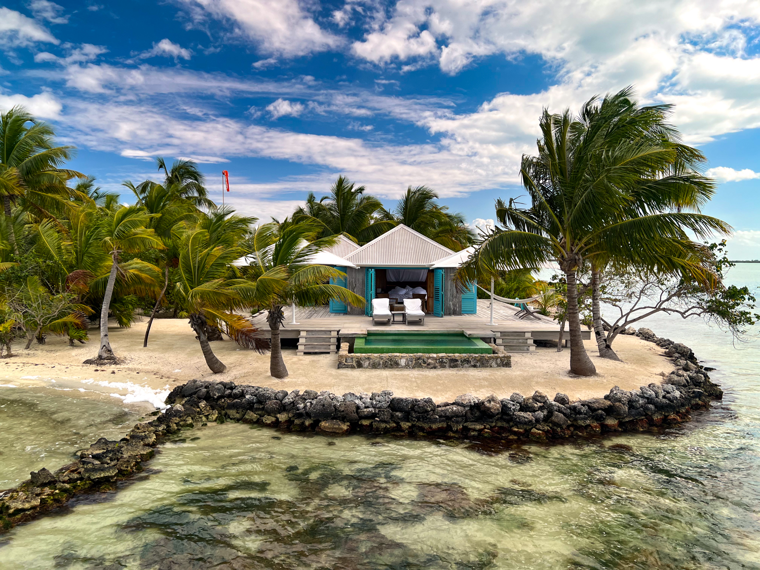 then we were led to a table set poolside Cayo Espanto Private Island Belize This is Travel Treasure